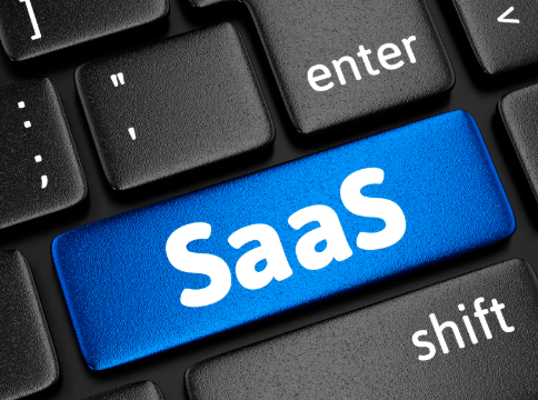 Image of a keyboard with a key containing the acronym SaaS (Software as a Service) highlighted in blue. It emphasises that the focus of the article is about SaaS marketing.